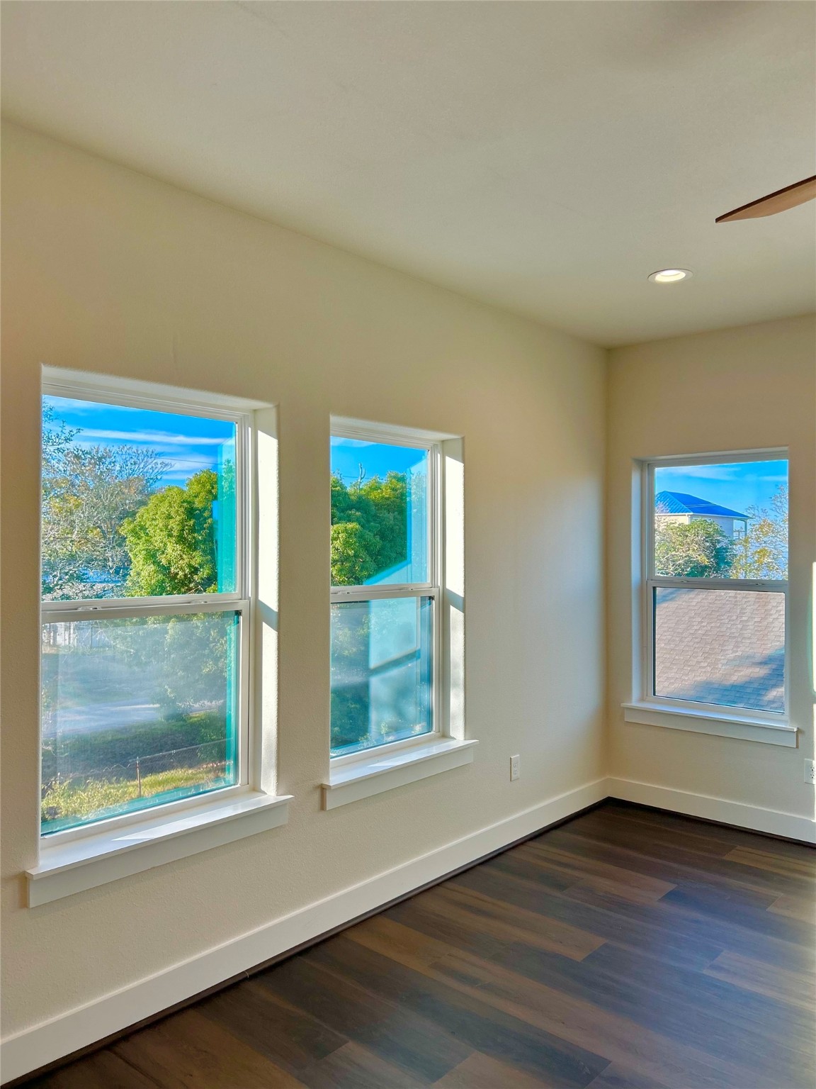 125 4th Street San Leon, TX 77539 - Photo 32 of 40 a view of an empty room with wooden floor and a window