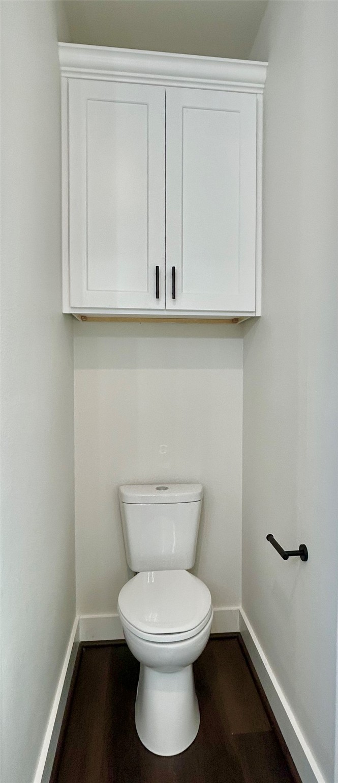 125 4th Street San Leon, TX 77539 - Photo 34 of 40 a white toilet sitting next to a bathroom sink