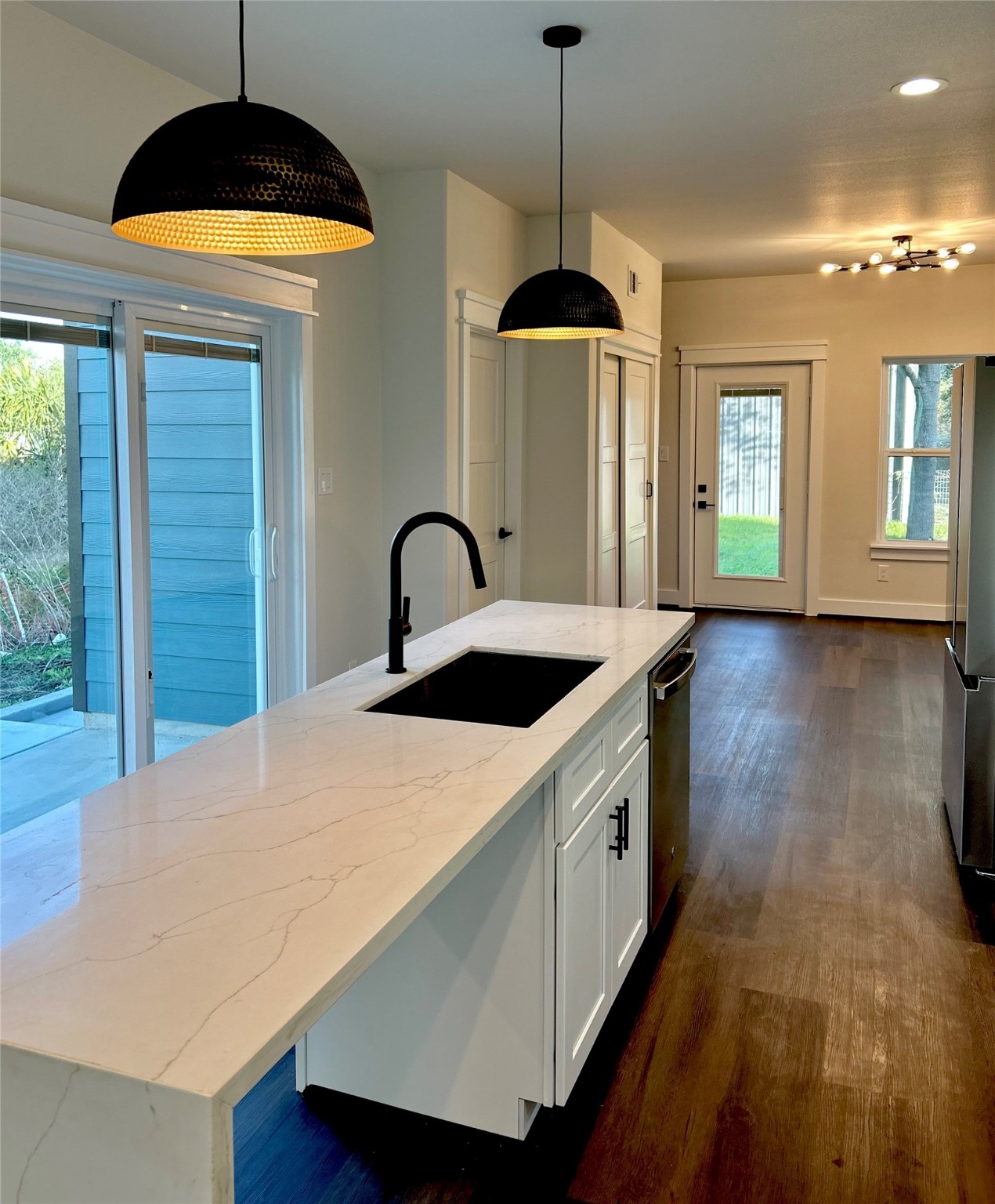 125 4th Street San Leon, TX 77539 - Photo 5 of 40 a kitchen with stainless steel appliances granite countertop a stove a sink a refrigerator and a window