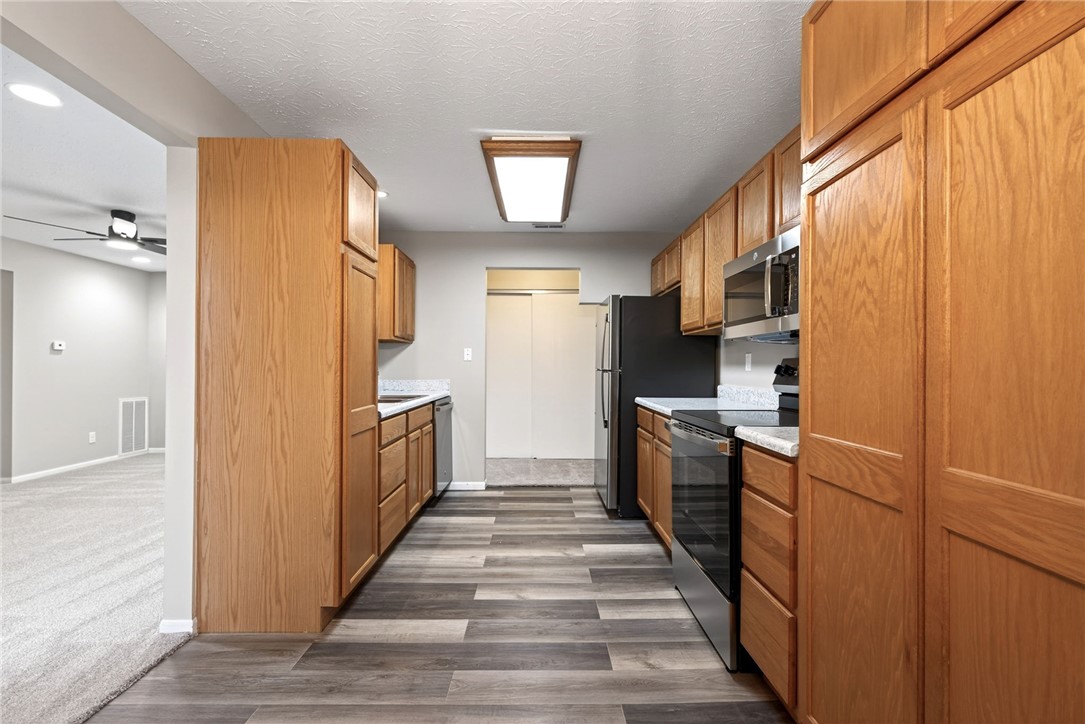 3151 Roesch Boulevard, Unit 6 Fairfield, OH 45014 - Photo 10 of 29 This galley kitchen features durable flooring and contemporary appliances, perfect for daily living.