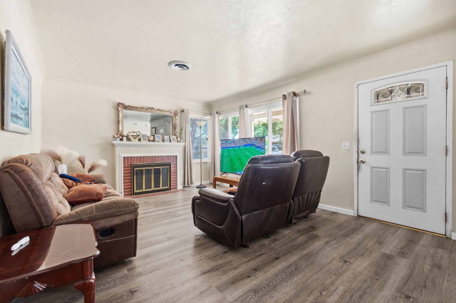 1705 Stetson Avenue Modesto, CA 95350 - Photo 6 of 32 a living room with furniture and a fireplace