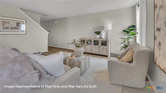 a living room with furniture and a couch