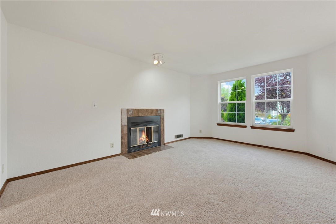 1230 224th Place Southwest Bothell, WA 98021 - Photo 2 of 22 an empty room with windows