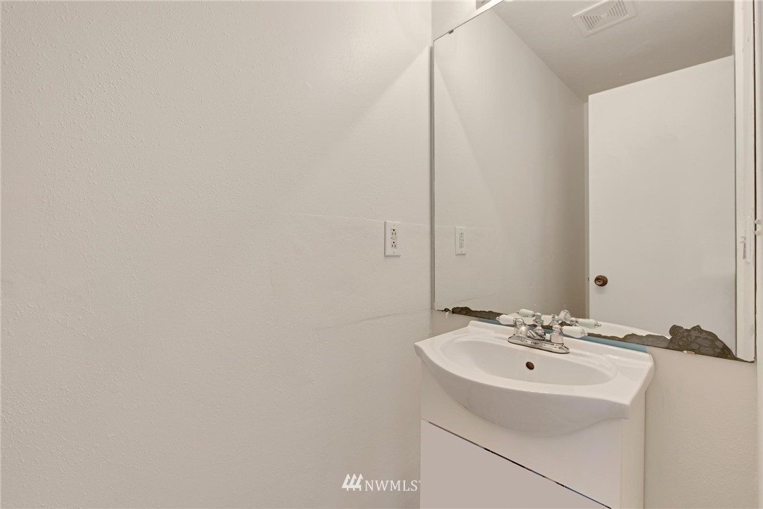 1230 224th Place Southwest Bothell, WA 98021 - Photo 12 of 22 a bathroom with a sink and a mirror