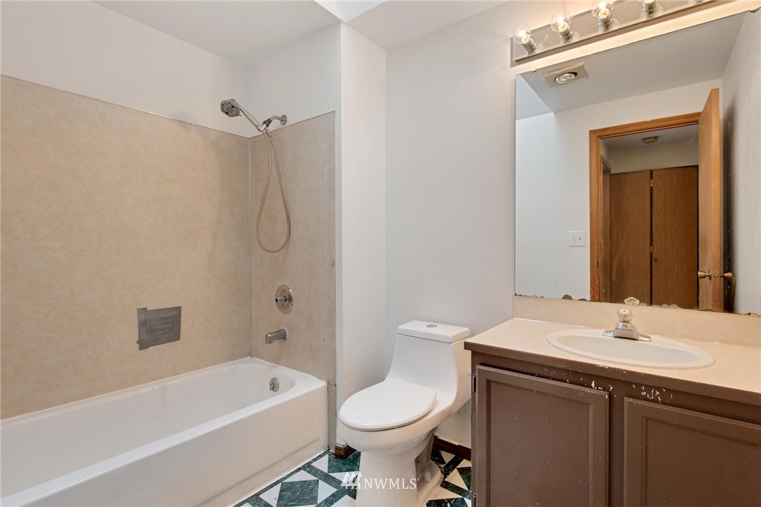 1230 224th Place Southwest Bothell, WA 98021 - Photo 13 of 22 a bathroom with a sink toilet and shower