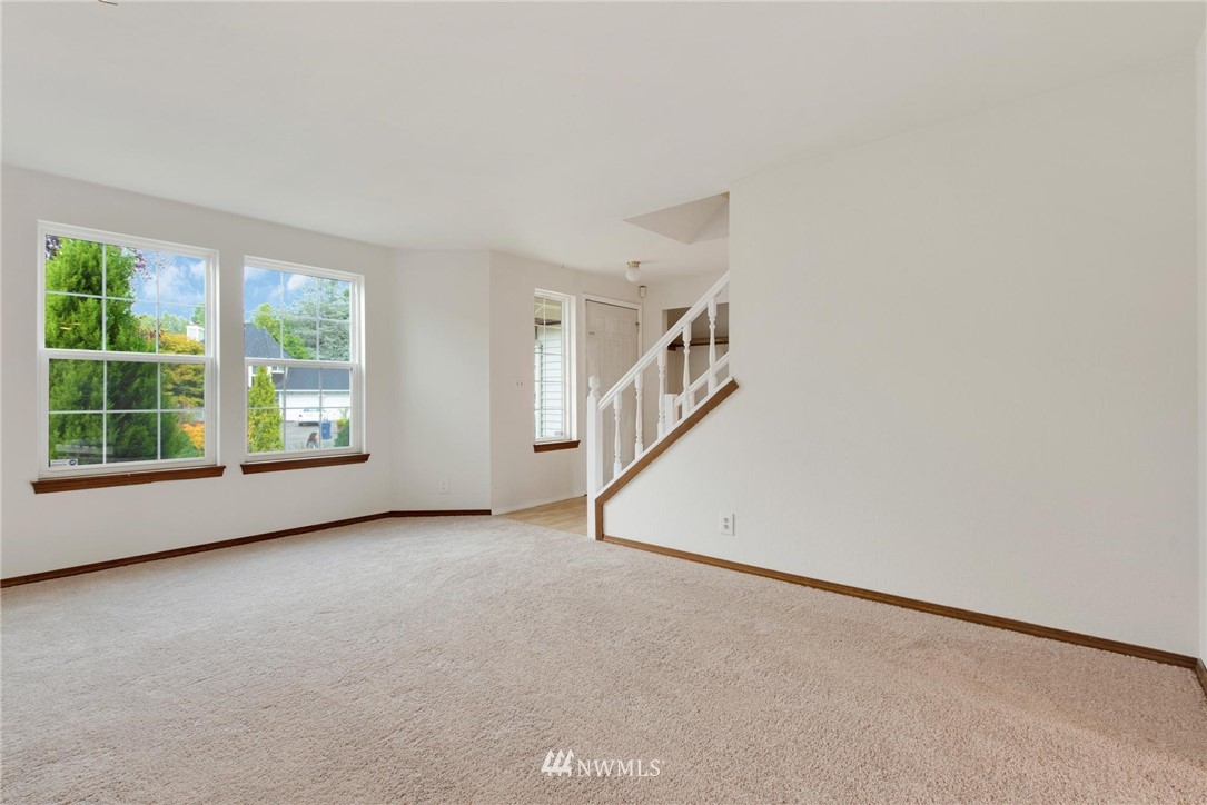 1230 224th Place Southwest Bothell, WA 98021 - Photo 3 of 22 an empty room with windows