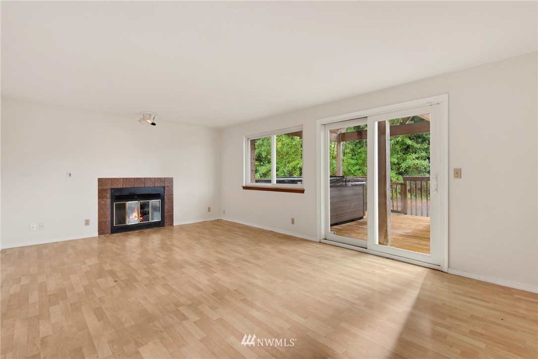 1230 224th Place Southwest Bothell, WA 98021 - Photo 9 of 22 an empty room with windows
