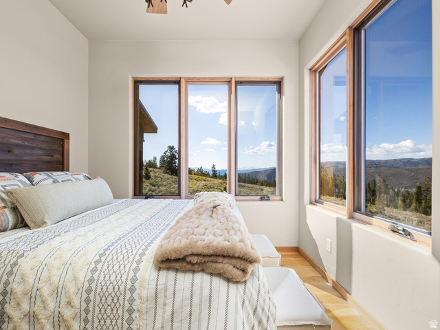 22677 East Snowbird Drive, Unit 47 Helper, UT 84526 - Photo 24 of 43 Bedroom with wood finished floors and a mountain view