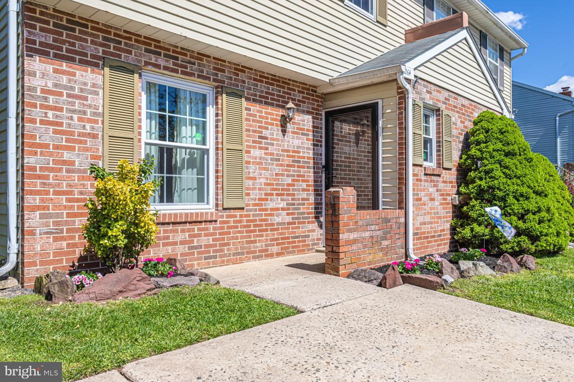 2064 Fort Bevon Road Harleysville, PA 19438 - Photo 2 of 25 a front view of a house with a yard and outdoor seating