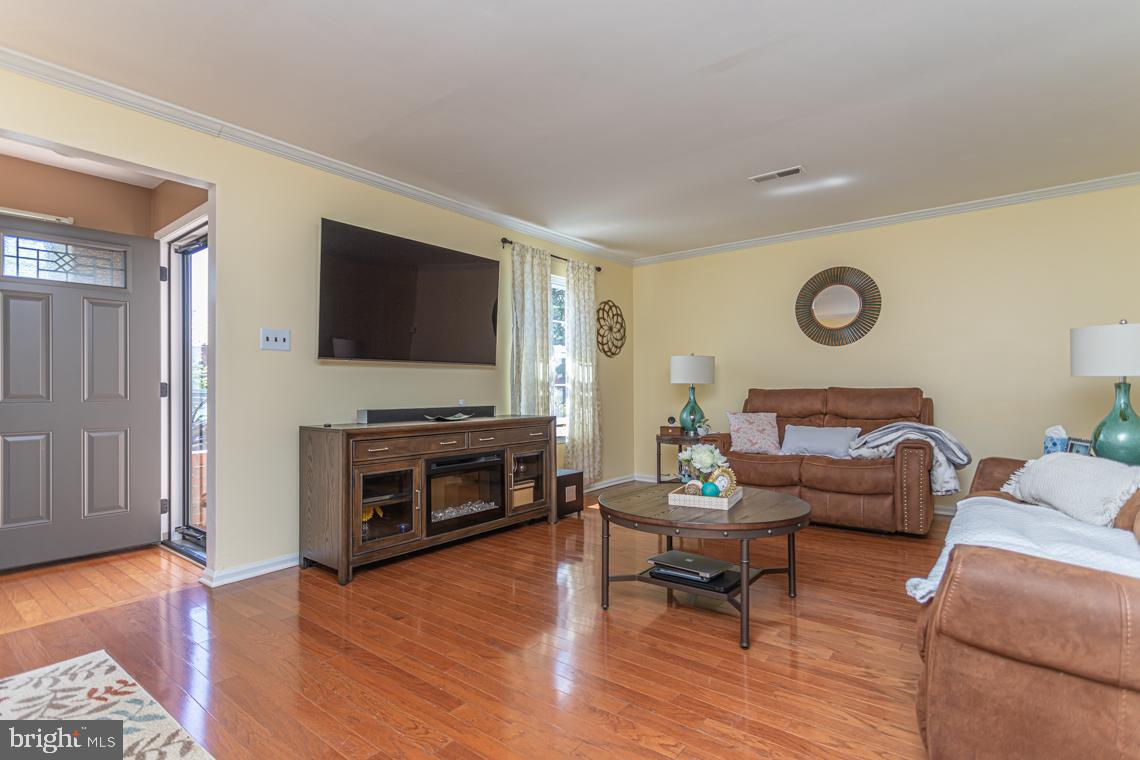 2064 Fort Bevon Road Harleysville, PA 19438 - Photo 3 of 25 a living room with furniture and a flat screen tv