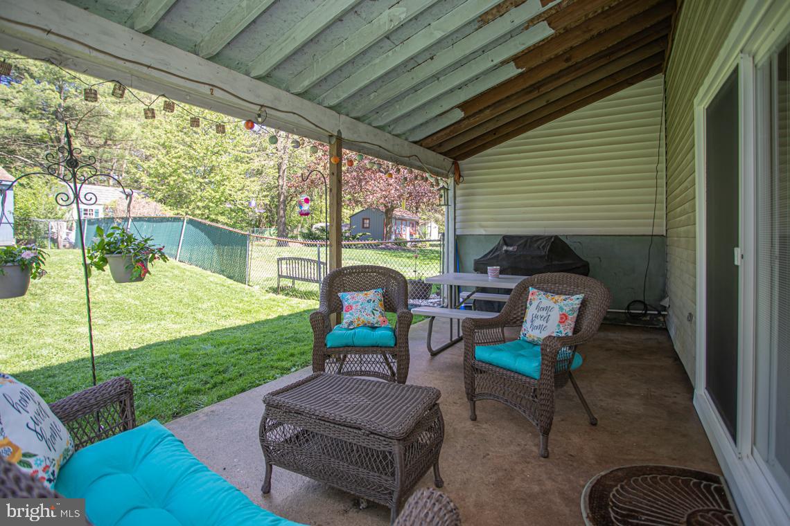 2064 Fort Bevon Road Harleysville, PA 19438 - Photo 21 of 25 a backyard of a house with outdoor seating