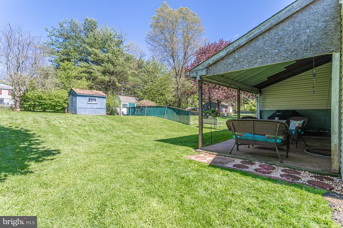 2064 Fort Bevon Road Harleysville, PA 19438 - Photo 24 of 25 a house view with a sitting space and garden