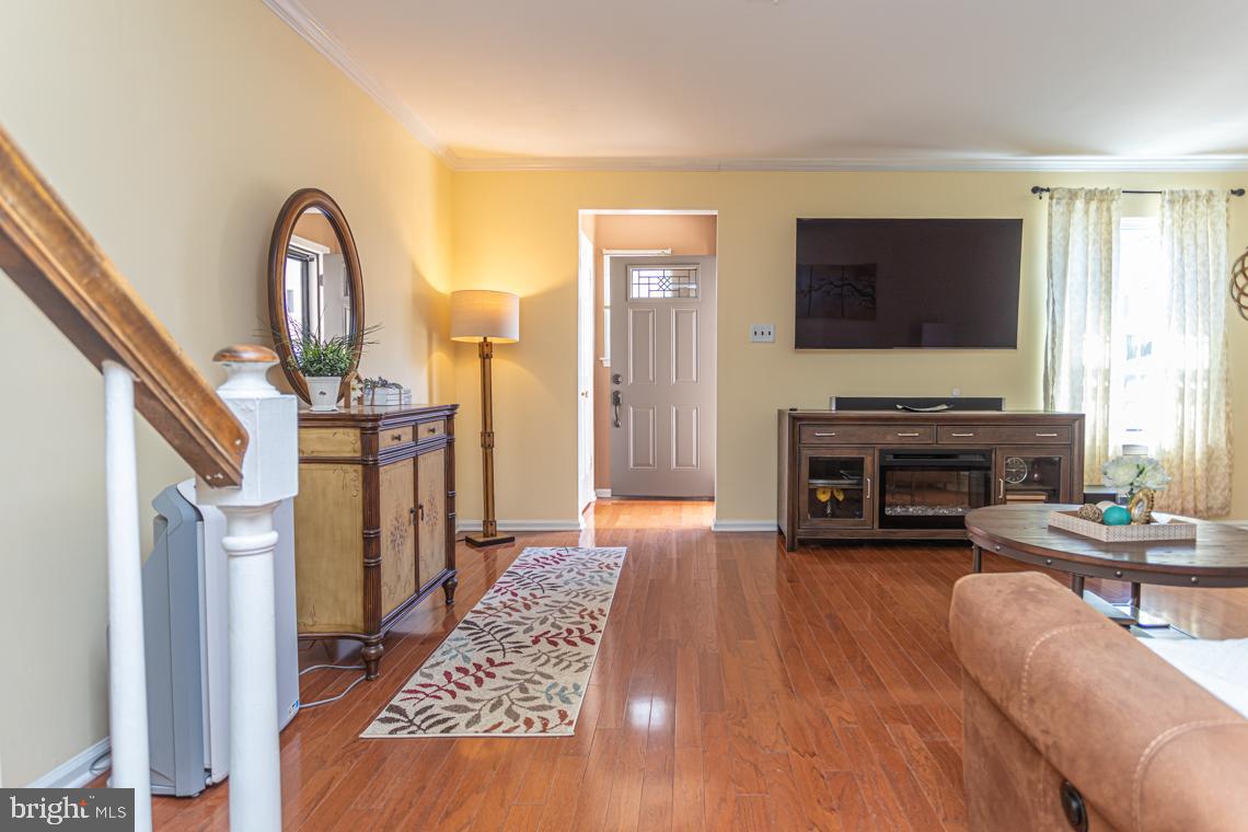 2064 Fort Bevon Road Harleysville, PA 19438 - Photo 4 of 25 a living room with furniture a fireplace and a flat screen tv