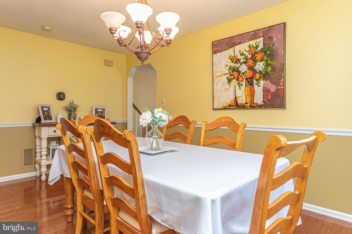 2064 Fort Bevon Road Harleysville, PA 19438 - Photo 7 of 25 a view of a dining room with furniture and chandelier