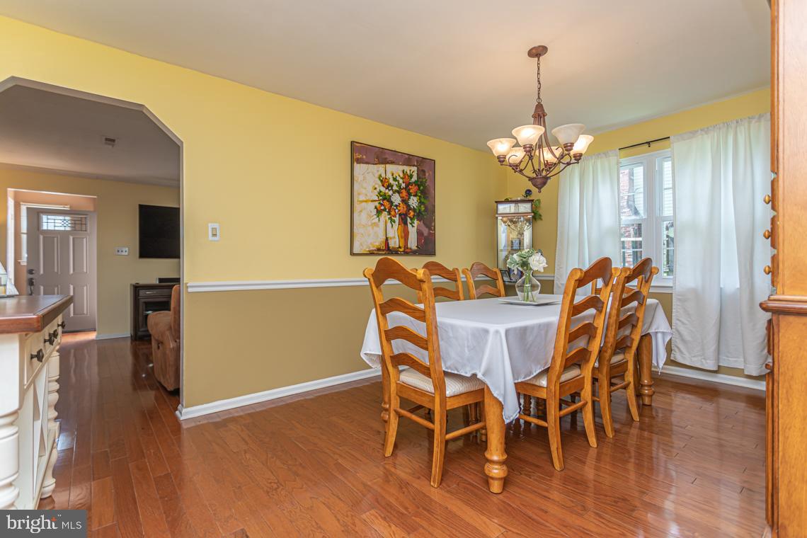 2064 Fort Bevon Road Harleysville, PA 19438 - Photo 8 of 25 a view of a dining room with furniture and wooden floor