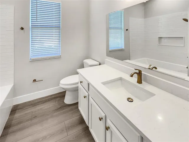 a bathroom with a sink and a toilet