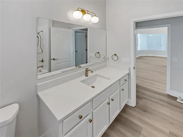 a bathroom with a sink double vanity and a mirror