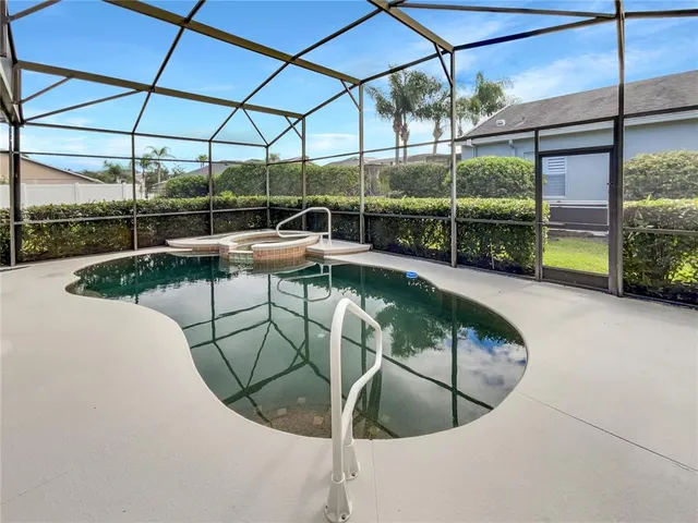a view of a swimming pool with a porch