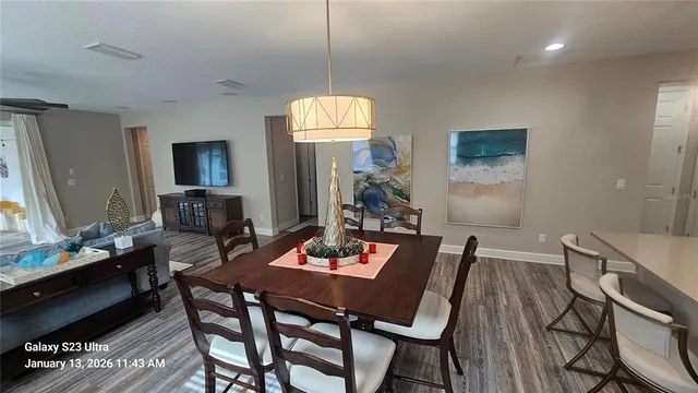 a view of a dining room with furniture and window