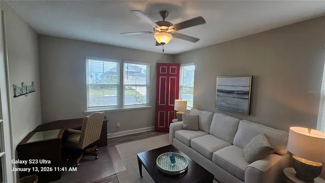 a living room with furniture and a window