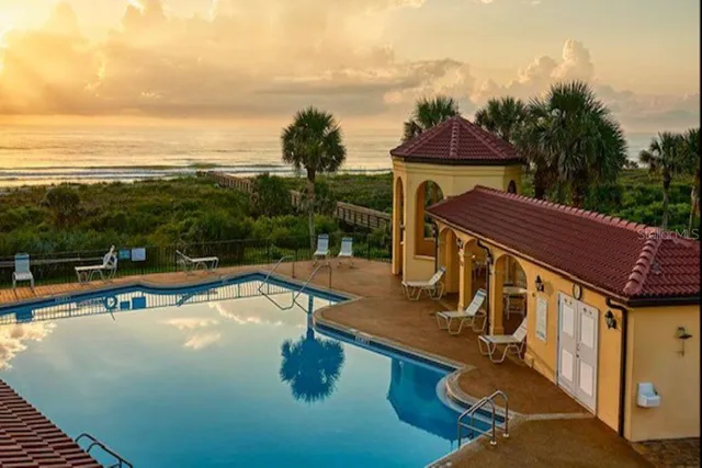 a view of a swimming pool with a lake view
