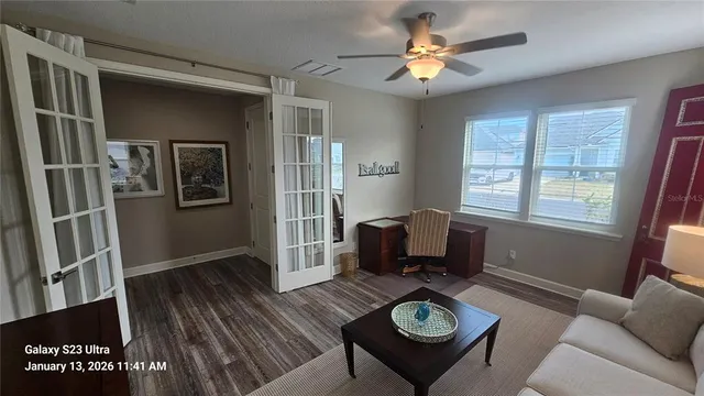 a living room with furniture a fireplace and a table