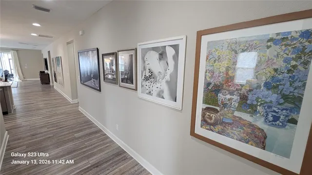 a view of gallery with wooden floor