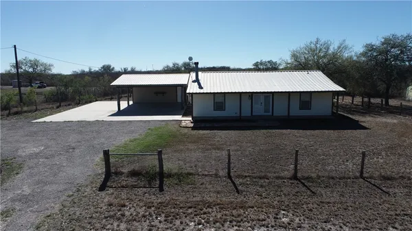 an aerial view of house with yard