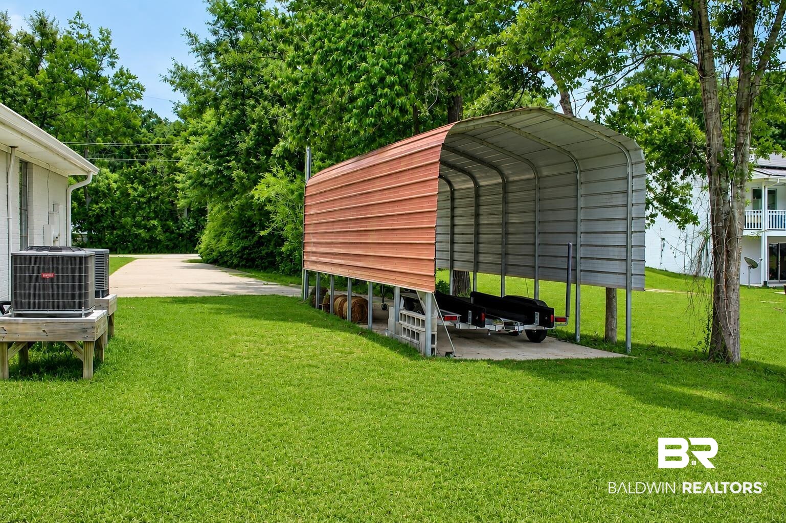 9825 Wolf Creek Ridge Elberta, AL 36530 - Photo 55 of 76 Covered storage structure with a concrete pad, metal framing, and partial siding