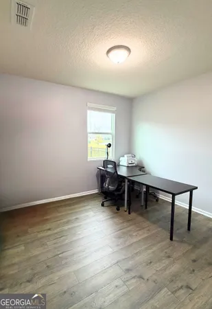 a bathroom with a sink and mirror with toilet