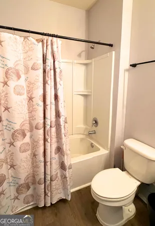a bathroom with a sink a mirror and a shower