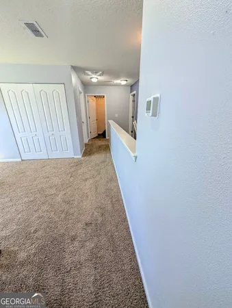 a living room with furniture and a gate