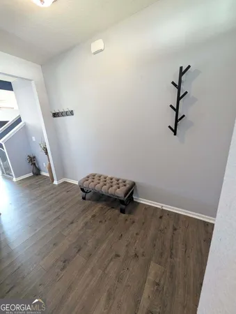 a kitchen with stainless steel appliances granite countertop a sink a stove and a wooden cabinets