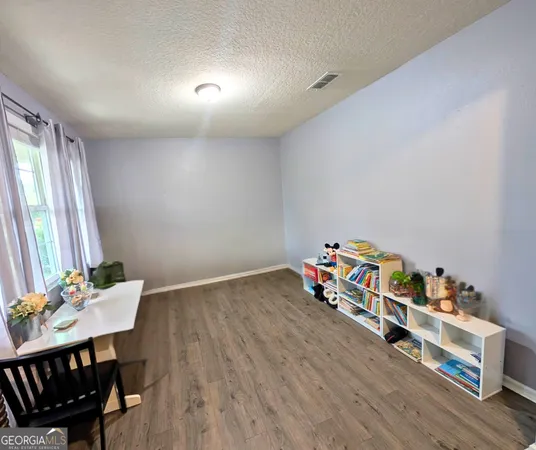 a kitchen with stainless steel appliances a stove a sink and a refrigerator