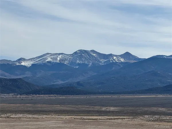 a view of an ocean and mountain