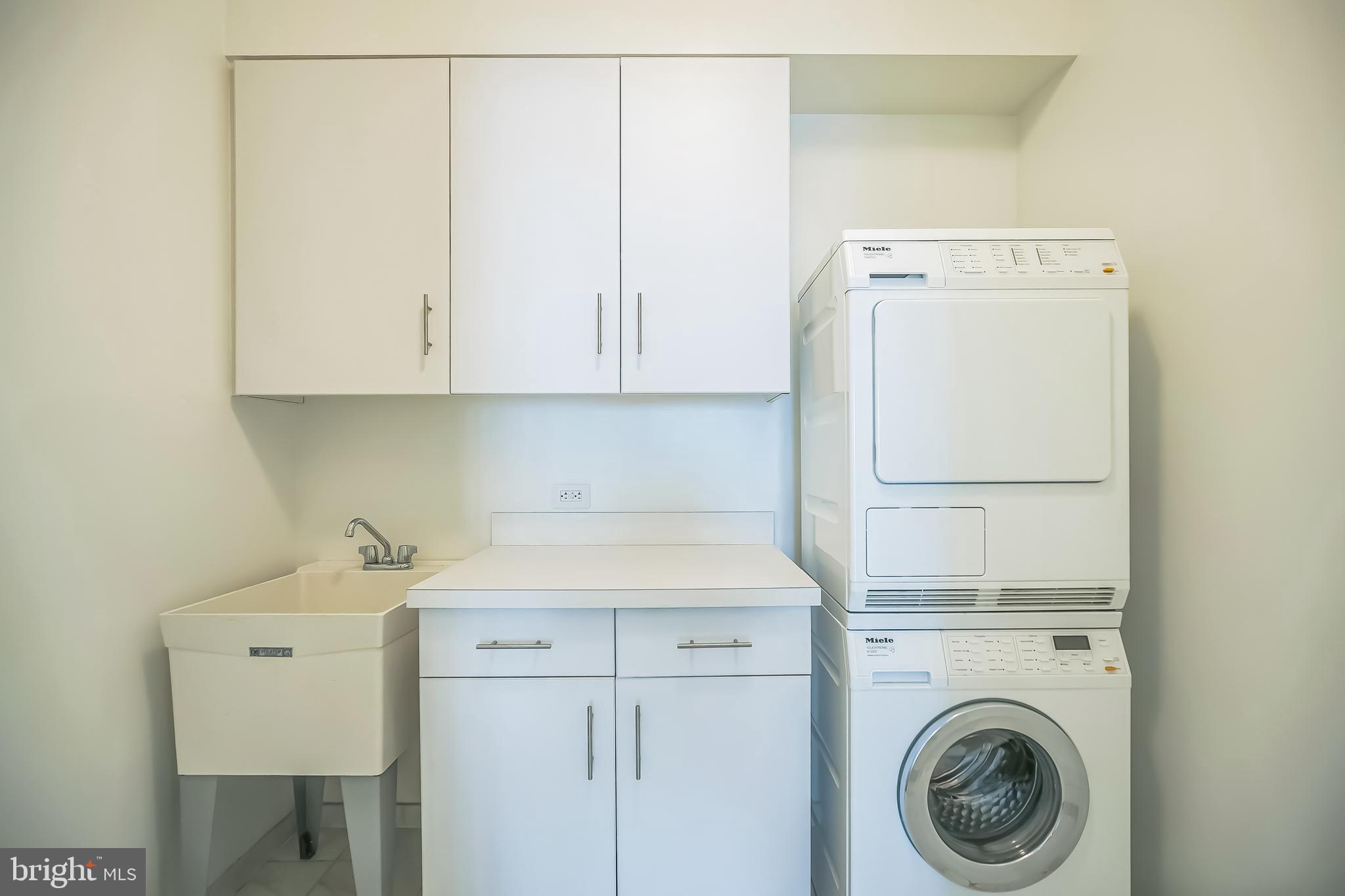 130 South 18th Street, Unit 2801 Philadelphia, PA 19103 - Photo 22 of 51 a utility room with dryer and washer
