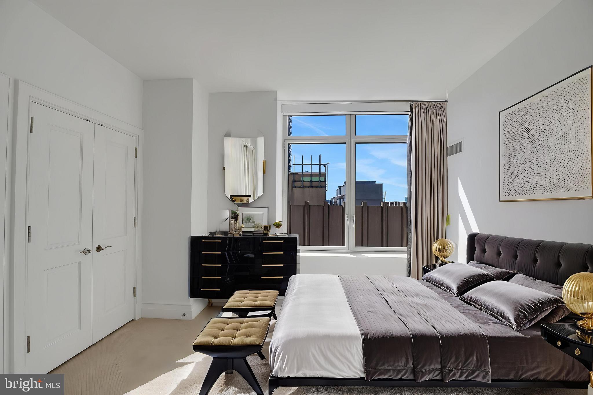 130 South 18th Street, Unit 2801 Philadelphia, PA 19103 - Photo 23 of 51 a bedroom with a bed and wooden floor