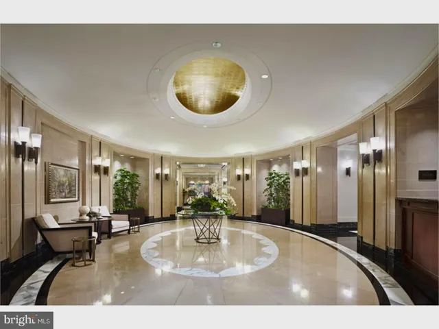 a large kitchen with stainless steel appliances granite countertop a stove a sink and a refrigerator