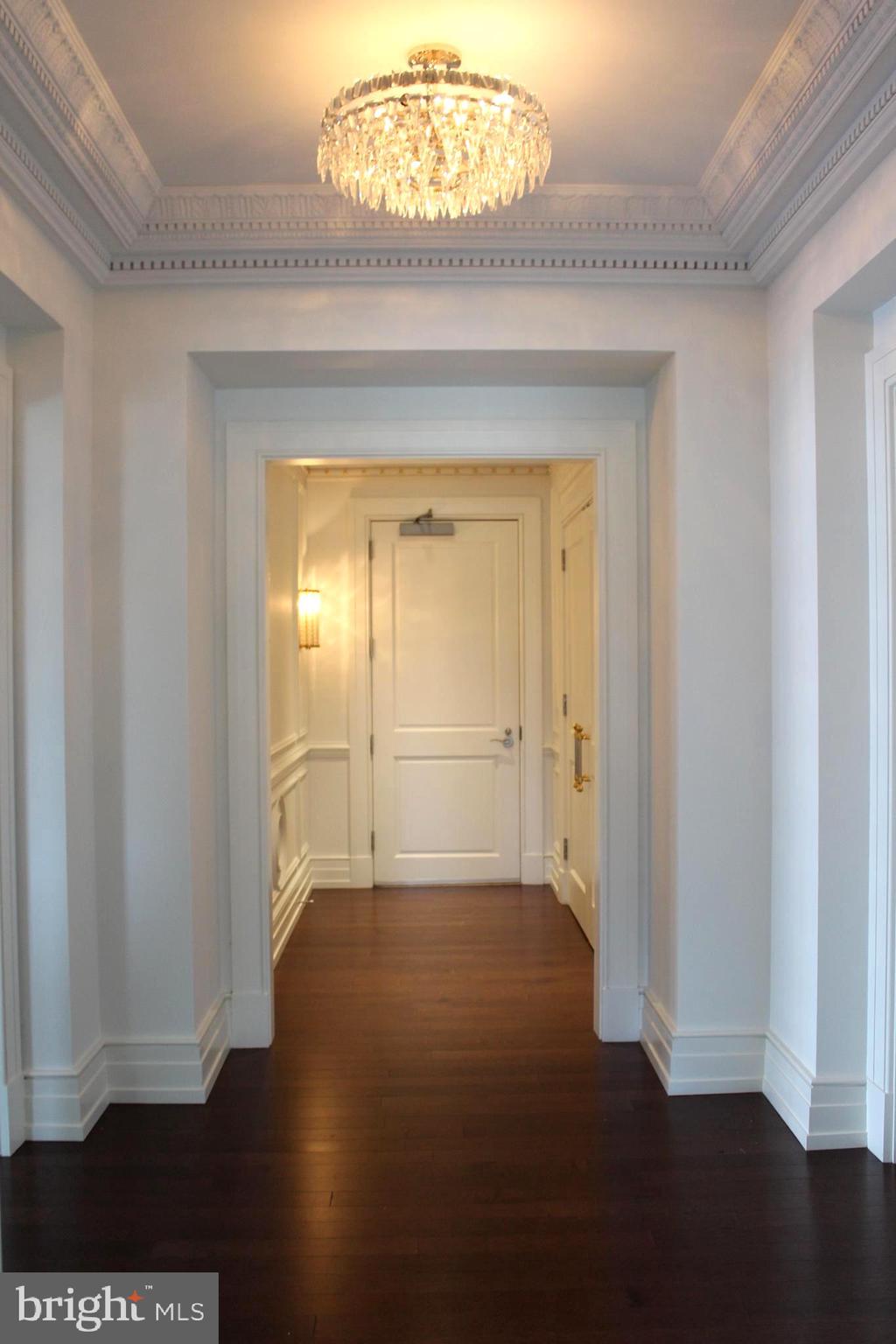 130 South 18th Street, Unit 2801 Philadelphia, PA 19103 - Photo 5 of 51 a view of a hallway with wooden floor