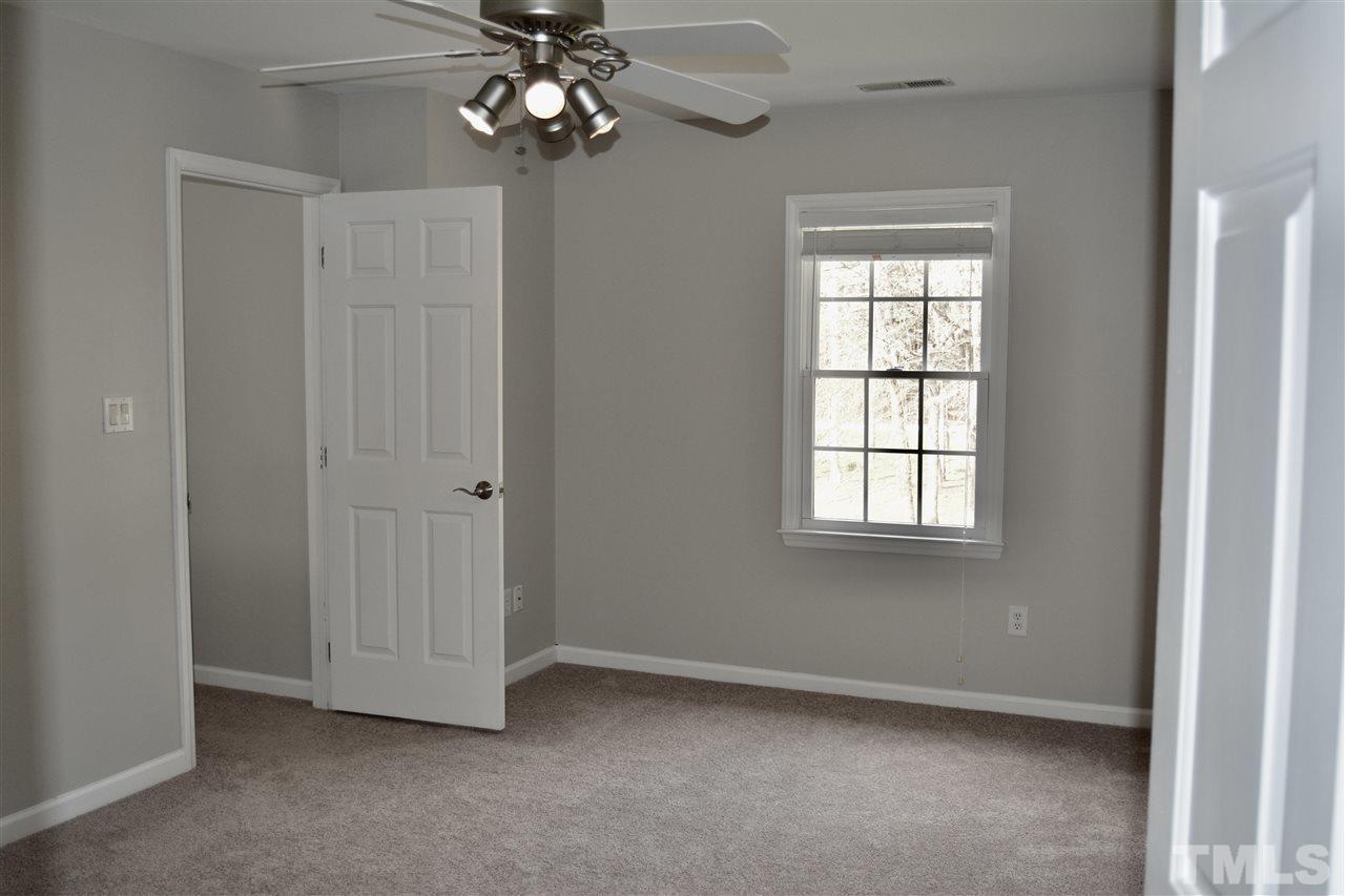 1625 Martin Pond Road Wendell, NC 27591 - Photo 17 of 30 Master bedroom with ceiling fan. Large enough to have a sitting area, with French doors leading into the masterbath.