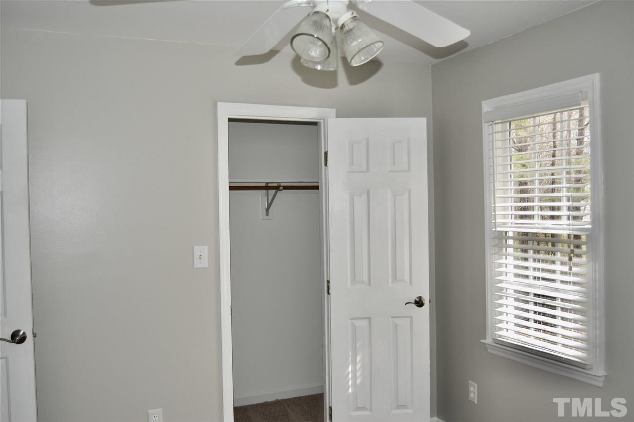 1625 Martin Pond Road Wendell, NC 27591 - Photo 22 of 30 2nd bedroom with ceiling fan & looks outback.