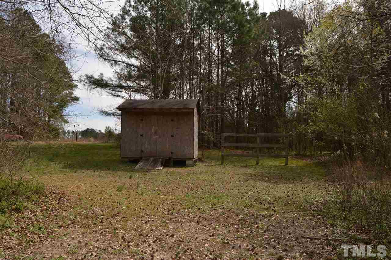 1625 Martin Pond Road Wendell, NC 27591 - Photo 27 of 30 On the other side of the fence you will find a nice size storage shed.