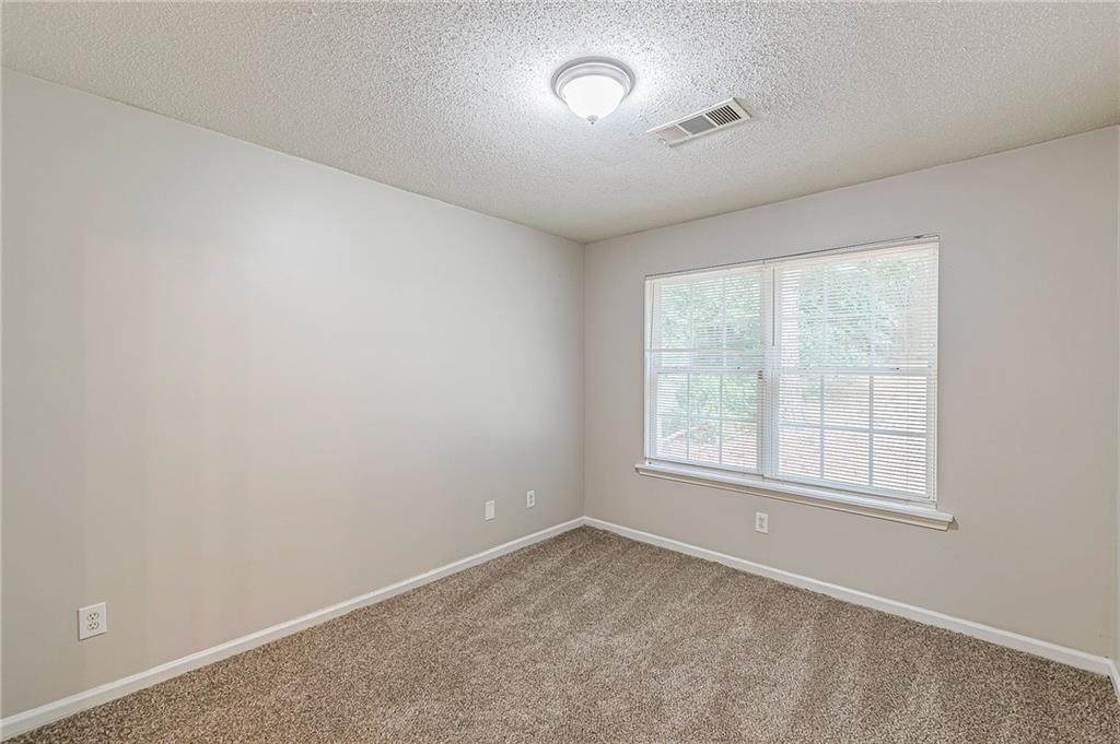 5850 Sable Glen Road Atlanta, GA 30349 - Photo 14 of 33 an empty room with a window