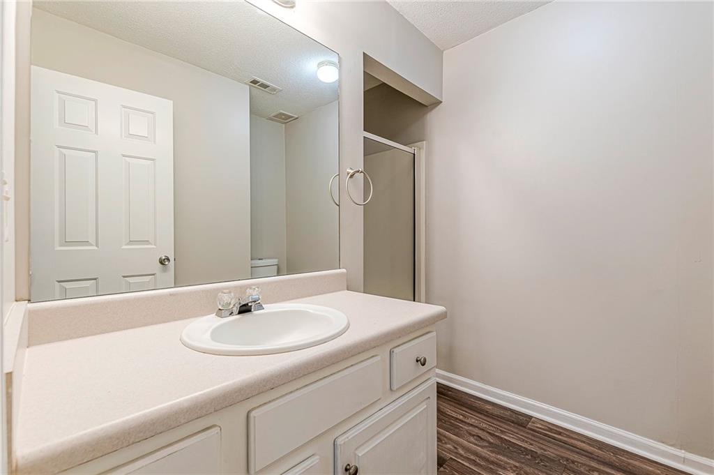 5850 Sable Glen Road Atlanta, GA 30349 - Photo 17 of 33 a bathroom with a sink and a mirror