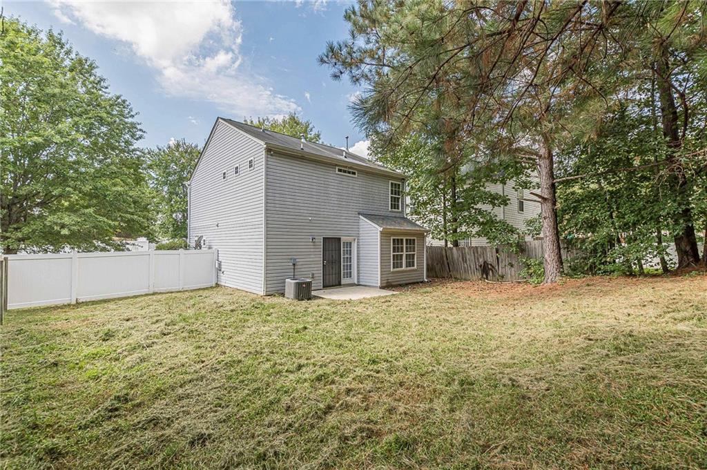 5850 Sable Glen Road Atlanta, GA 30349 - Photo 2 of 33 a view of a house with a yard