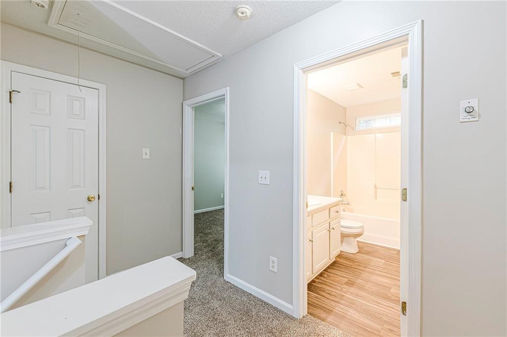 5850 Sable Glen Road Atlanta, GA 30349 - Photo 33 of 33 a bathroom with a sink and a bathtub