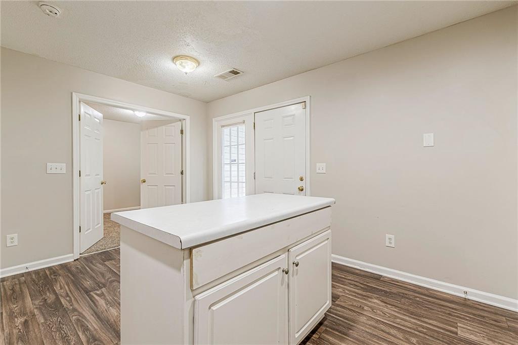 5850 Sable Glen Road Atlanta, GA 30349 - Photo 9 of 33 a utility room with cabinets washer and dryer