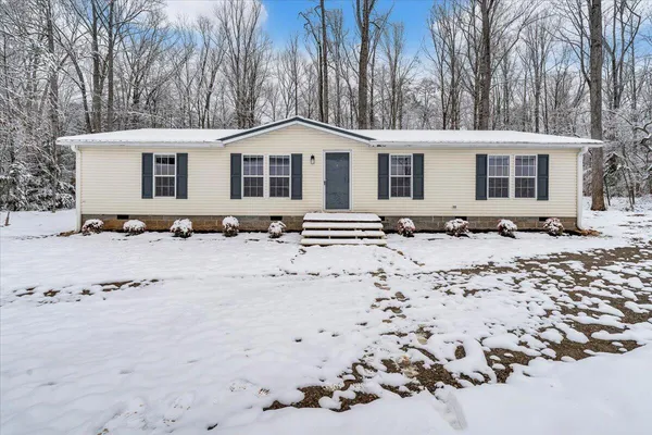a view of a covered with snow in the yard