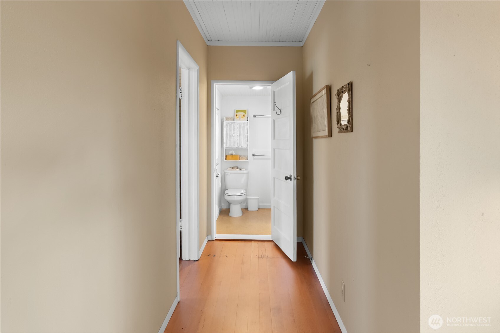 212 2nd Street Northeast Long Beach, WA 98631 - Photo 17 of 33 a view of a hallway with wooden floor