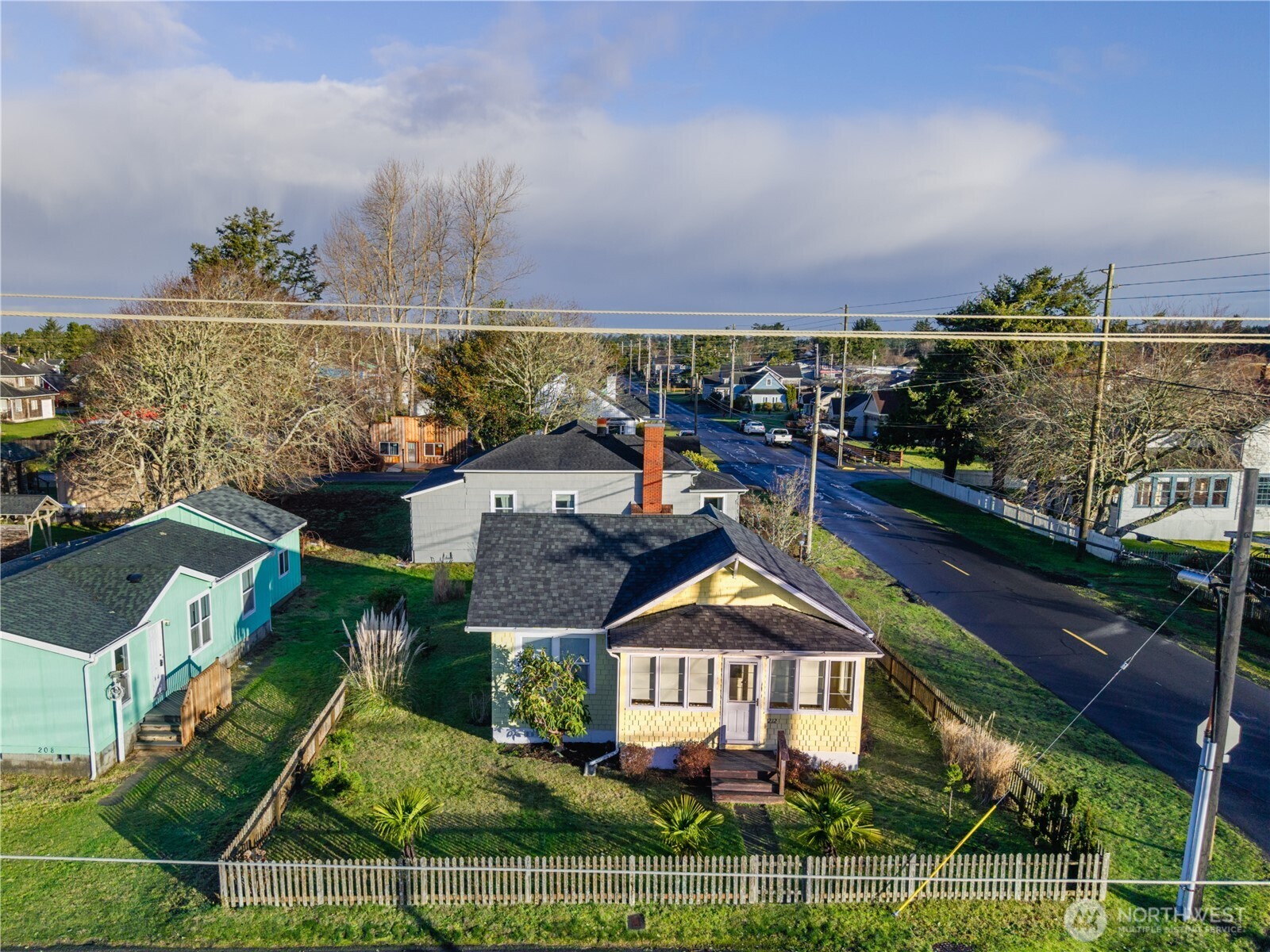 212 2nd Street Northeast Long Beach, WA 98631 - Photo 28 of 33 a front view of a house with a yard and potted plants